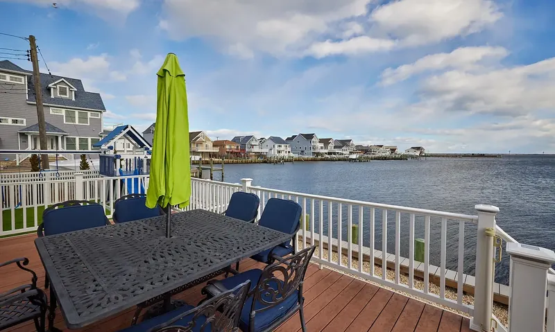 Outdoor dining table on the deck over the water